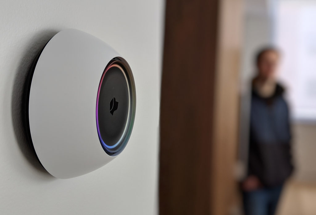 Josh.ai voice control device mounted on a living room wall