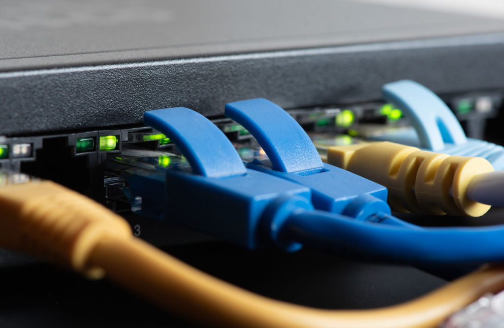 Network switch with connected patch cables
